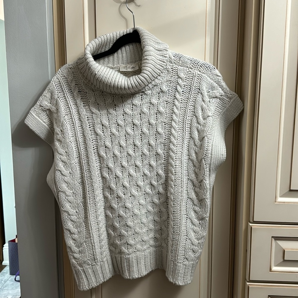Sleeveless sweater. Current season.